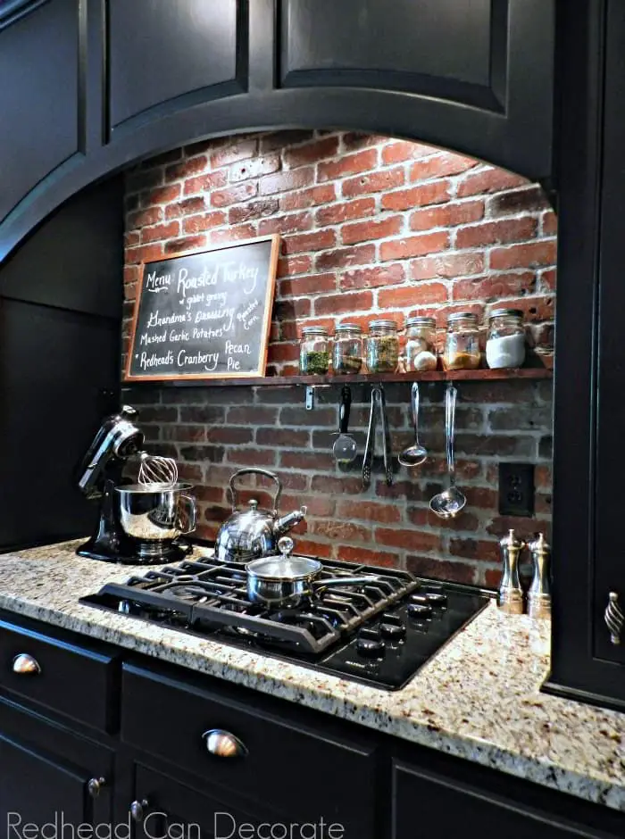 Black Kitchen Cabinet With Brick Backsplash