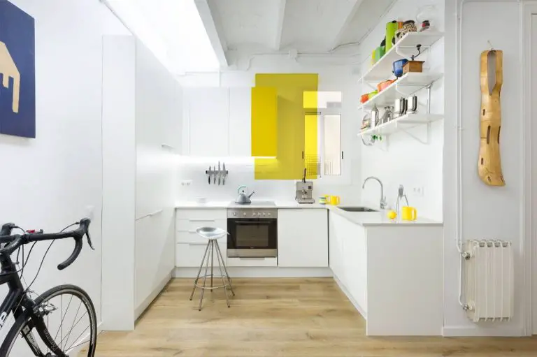 L-shaped kitchen layout with corner window