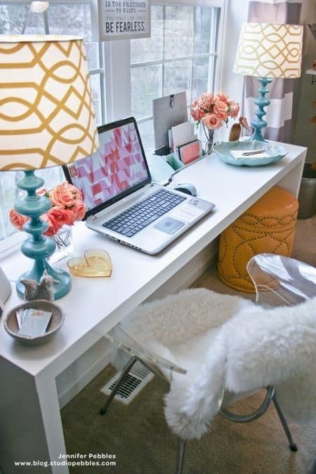 bedroom workstation with laptop and patterned lamp 