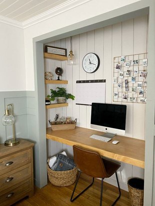 cloffice with wooden desk and shiplap walling and decor