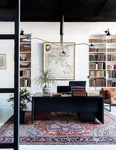 modern and bright library home office with antique rug