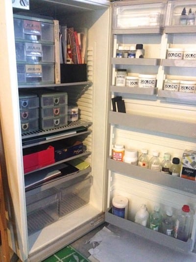 re-purposed fridge with art supplies